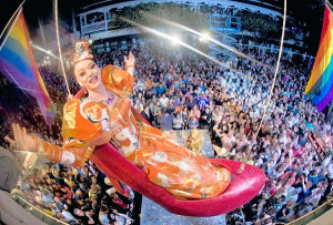 Female impersonator Gary Marion, as "Sushi," dangles above New Year's Eve revellers in a giant replica of a woman's high heel at the Bourbon Street Pub complex in Key West, Florida, December 31, 2011. The Red Shoe Drop is a Key West tradition to celebrate the arrival of the new year. REUTERS/Andy Newman/Florida Keys News Bureau/Handout (UNITED STATES - Tags: SOCIETY ENTERTAINMENT TPX IMAGES OF THE DAY) FOR EDITORIAL USE ONLY. NOT FOR SALE FOR MARKETING OR ADVERTISING CAMPAIGNS. THIS IMAGE HAS BEEN SUPPLIED BY A THIRD PARTY. IT IS DISTRIBUTED, EXACTLY AS RECEIVED BY REUTERS, AS A SERVICE TO CLIENTS ORG XMIT: KWP06